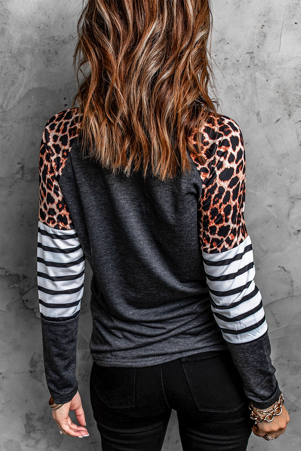 Black Leopard Striped Long Sleeve Top featuring a stylish mix of leopard print and striped patterns, perfect for casual wear.