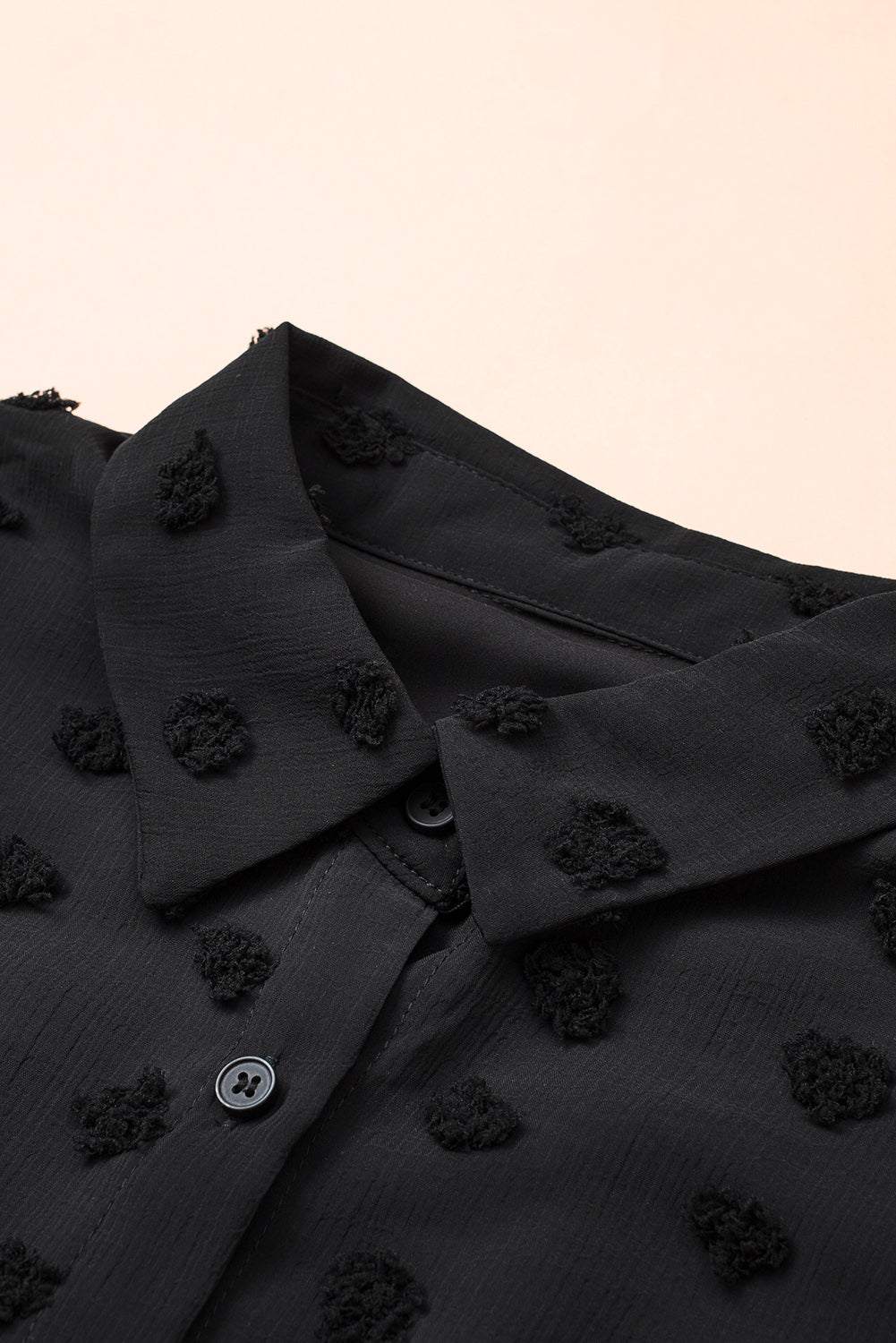 Black long sleeve shirt with fuzzy polka dot pattern, featuring button closure and relaxed fit, perfect for casual or formal wear.