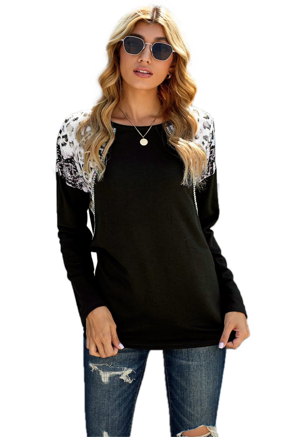 Black long sleeve top featuring a leopard snakeskin print, showcasing its stylish design and comfortable fabric.