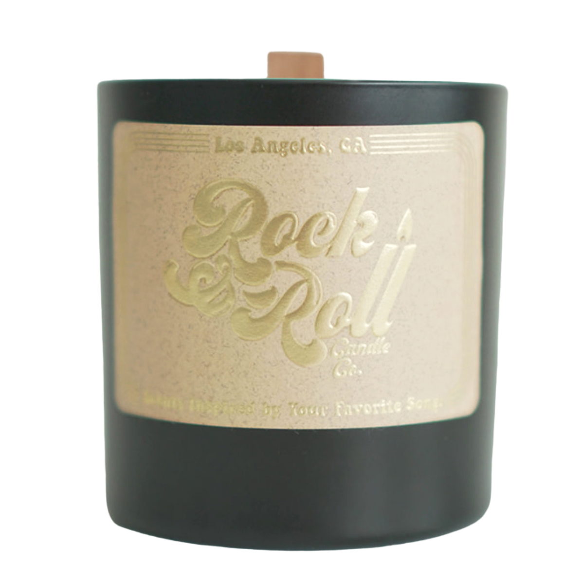 Black Magic Woman candle in a sleek black container, featuring a warm glow and a rich aroma of salted caramel and vanilla.