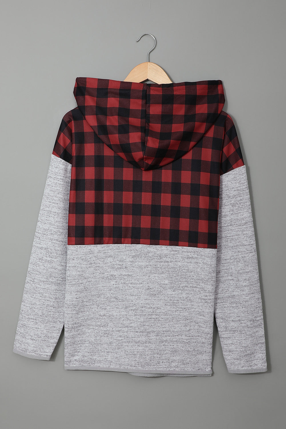 Black plaid splicing pocketed hoodie featuring a loose design and buttoned neckline, perfect for autumn wear.