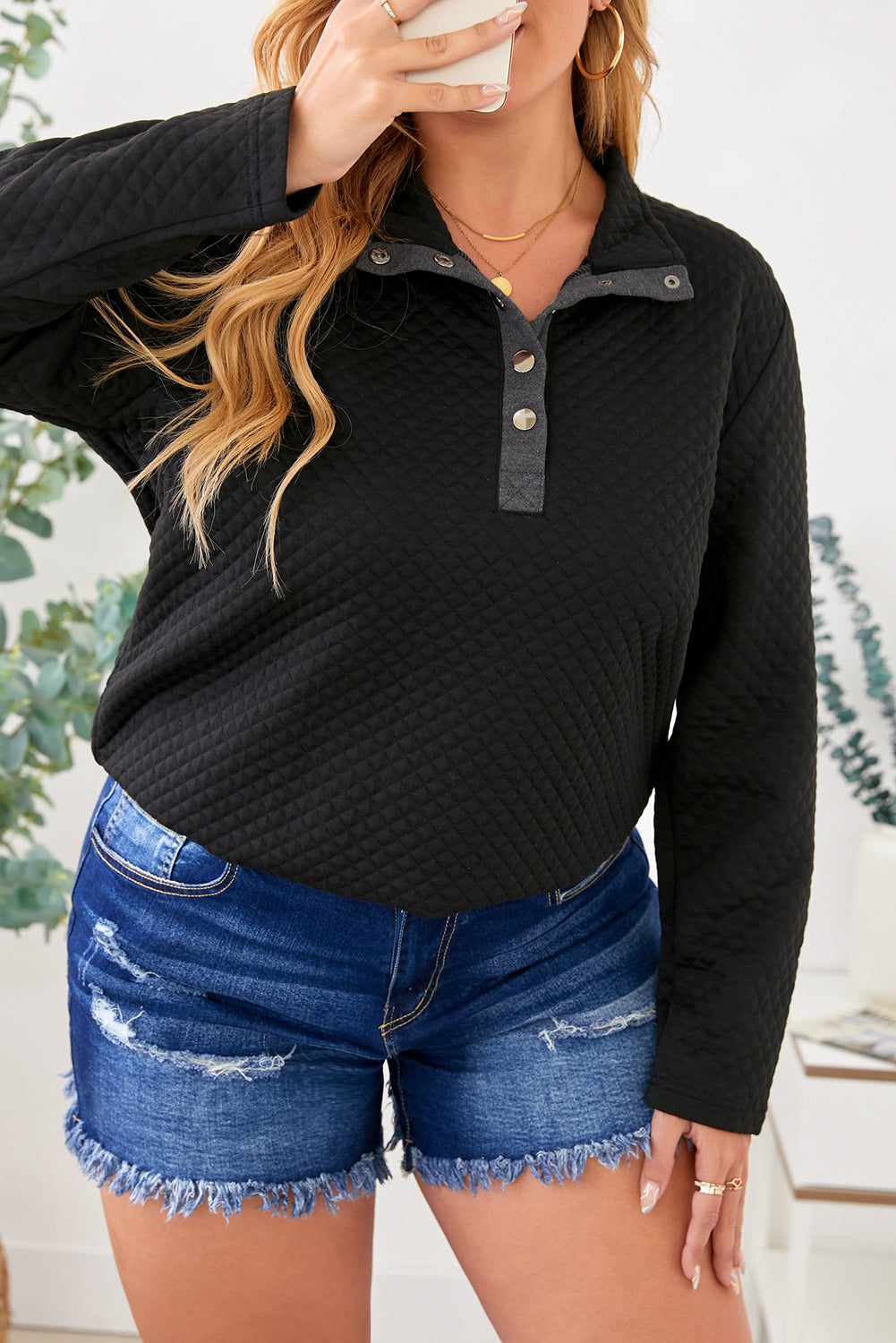 Black Plus Size Quilted Button Up Henley Sweatshirt displayed on a mannequin, showcasing its stylish quilted design and button-up feature.