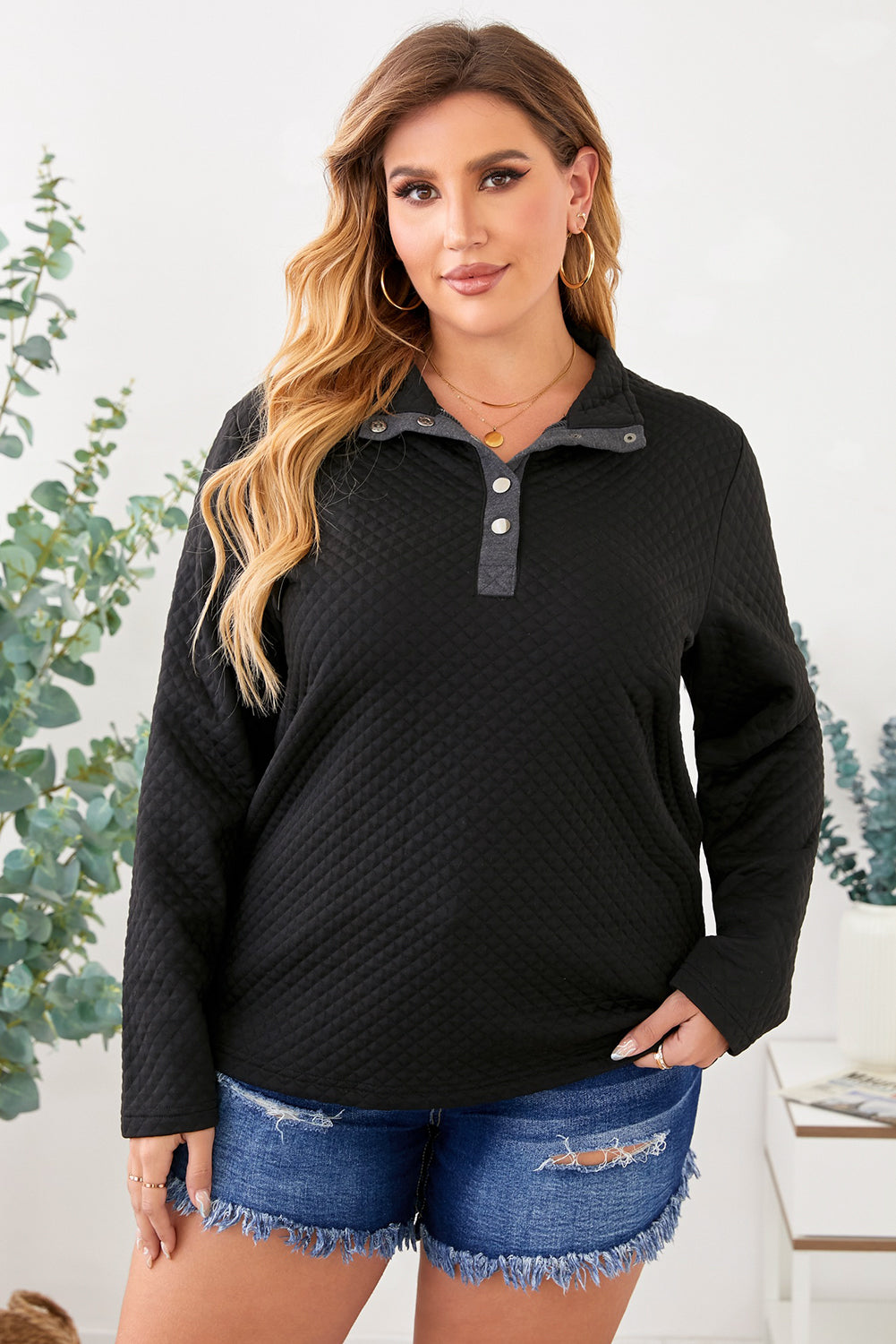 Black Plus Size Quilted Button Up Henley Sweatshirt displayed on a mannequin, showcasing its stylish quilted design and button-up feature.