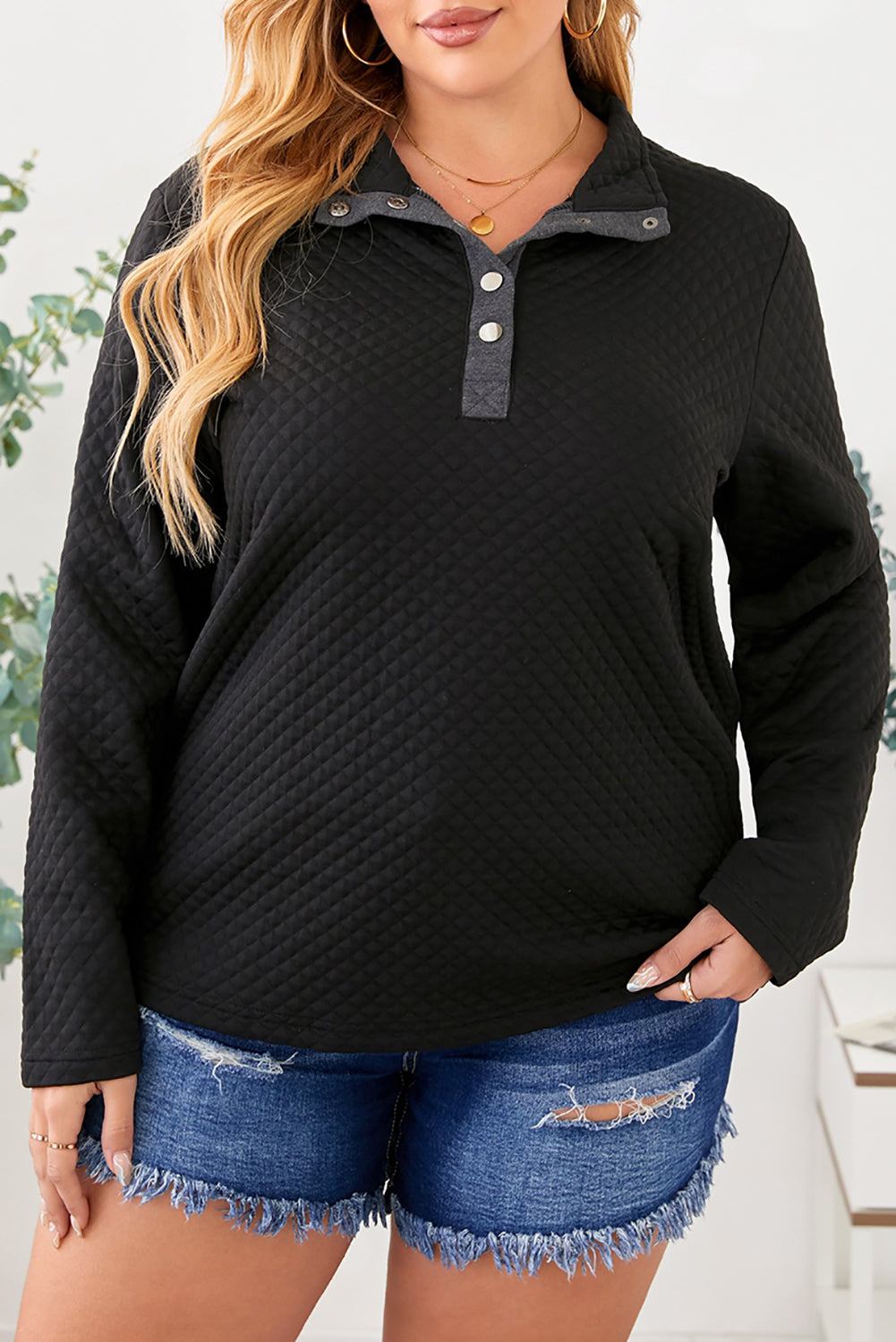 Black Plus Size Quilted Button Up Henley Sweatshirt displayed on a mannequin, showcasing its stylish quilted design and button-up feature.