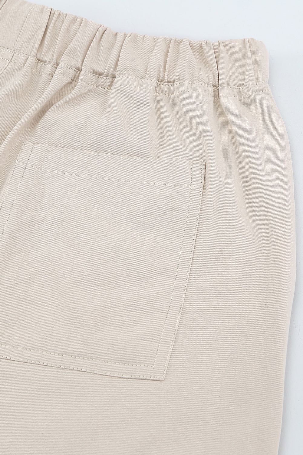 Black casual shorts with raw hem and pockets, featuring a drawstring waist for adjustable fit.