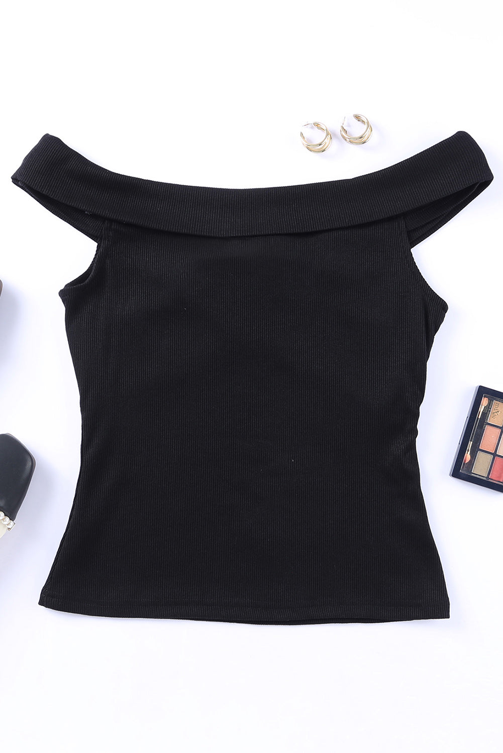 A stylish black ribbed off-shoulder top featuring a criss-cross design, showcasing a flattering slim-fit silhouette.