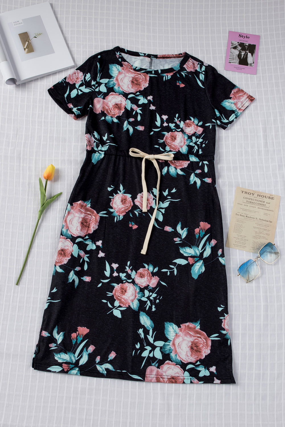 Black short sleeve casual floral dress with pockets and drawstring waist, perfect for summer outings.