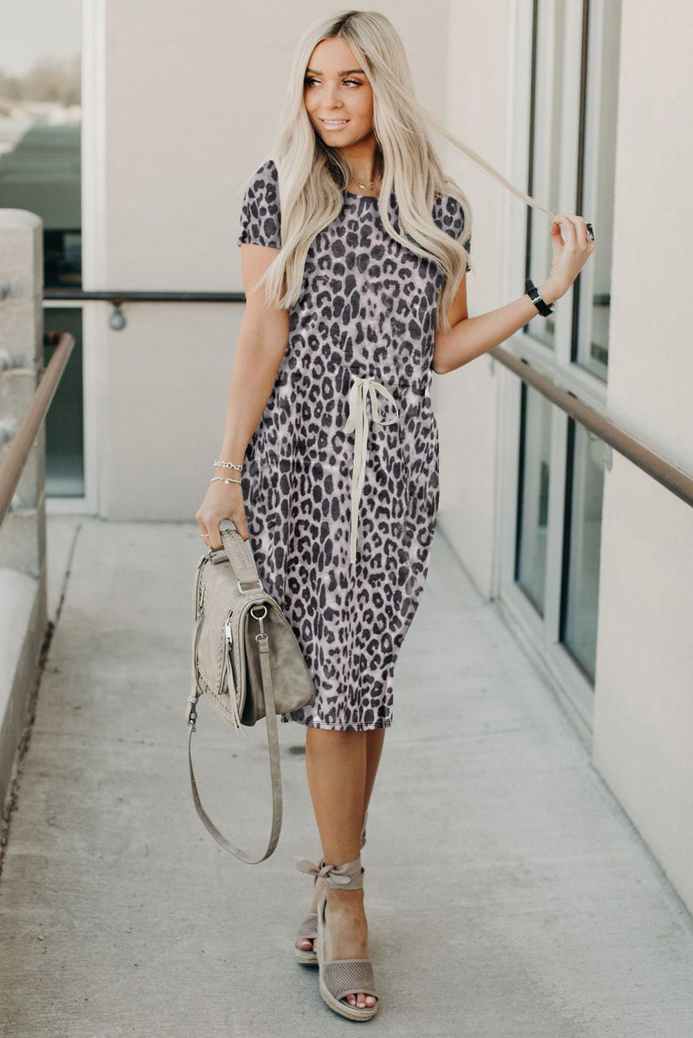 Black short sleeve casual floral dress with pockets and drawstring waist, perfect for summer outings.