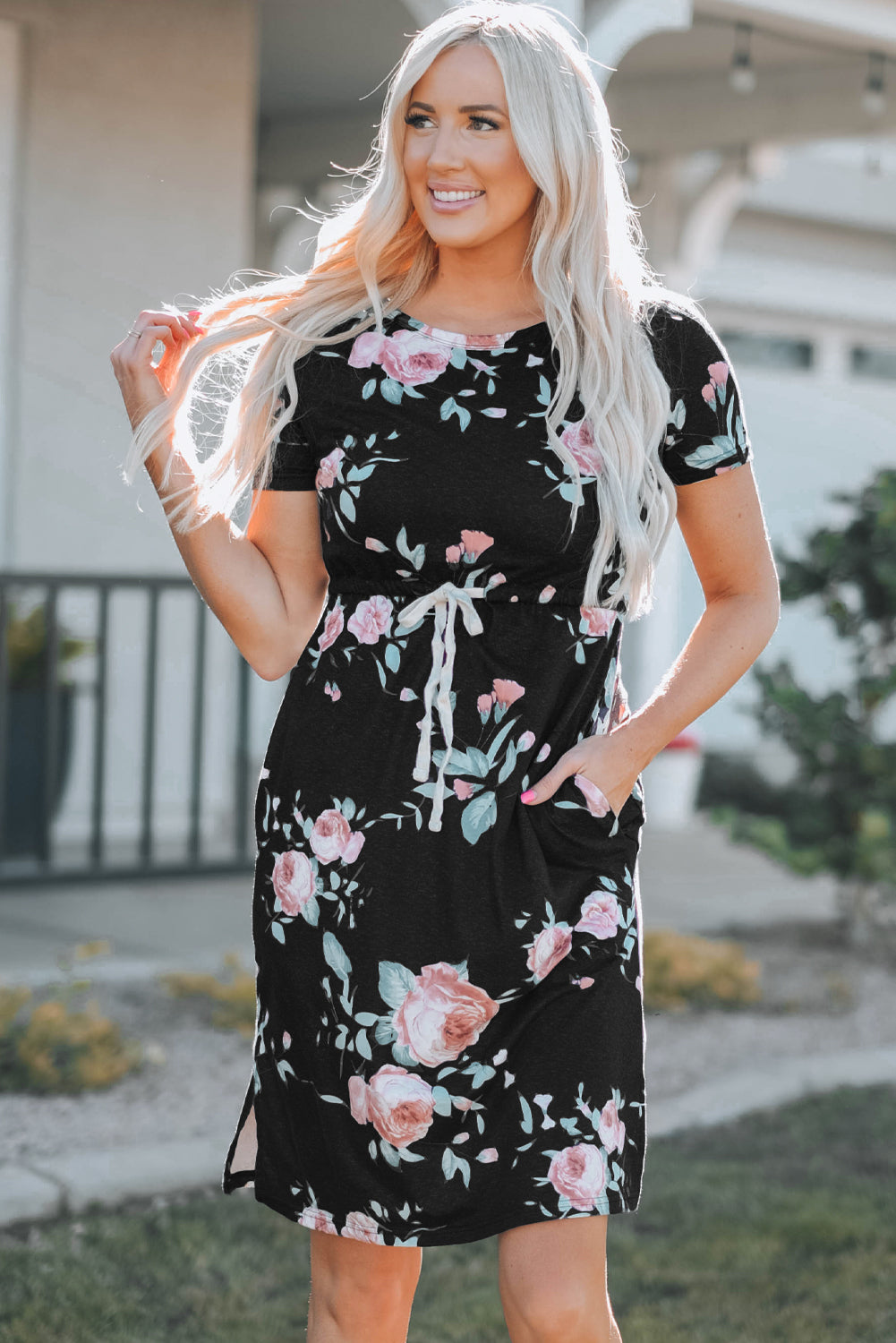 Black short sleeve casual floral dress with pockets and drawstring waist, perfect for summer outings.