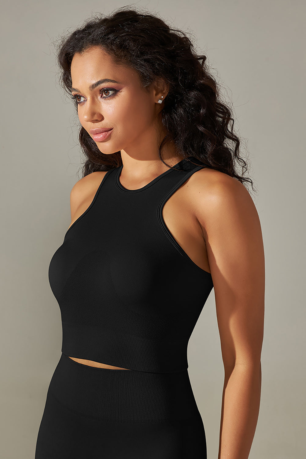 Black solid color crew neck cropped sports tank top, sleeveless design for optimal ventilation, perfect for workouts and casual wear.