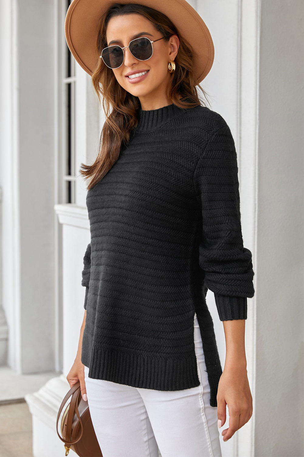 Black solid color sweater with stand collar and textured fabric, featuring long sleeves and a loose fit design.