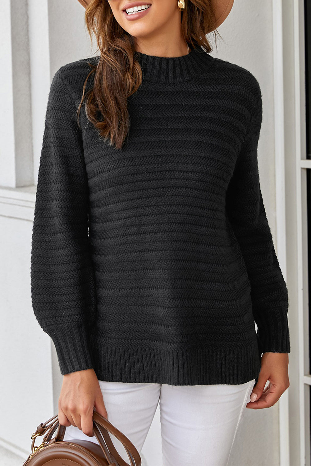 Black solid color sweater with stand collar and textured fabric, featuring long sleeves and a loose fit design.