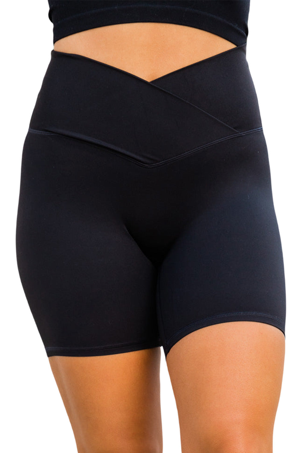 Black solid color yoga shorts with a V-shaped waistband, designed for comfort and style during workouts.