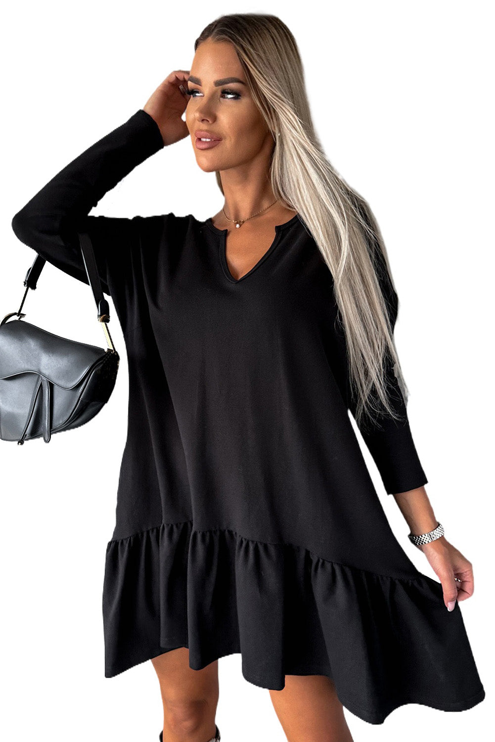 A stylish black dress featuring a split neck, long sleeves, and a ruffled hem, perfect for various occasions.