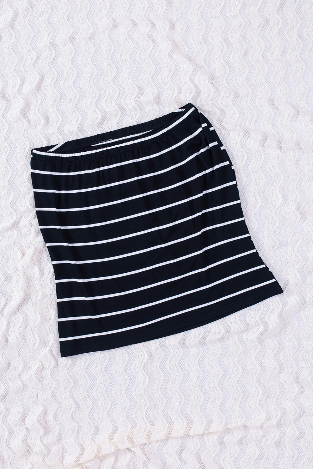 Black Striped Strapless Bandeau Tank showcasing a classic striped pattern, perfect for summer styling.