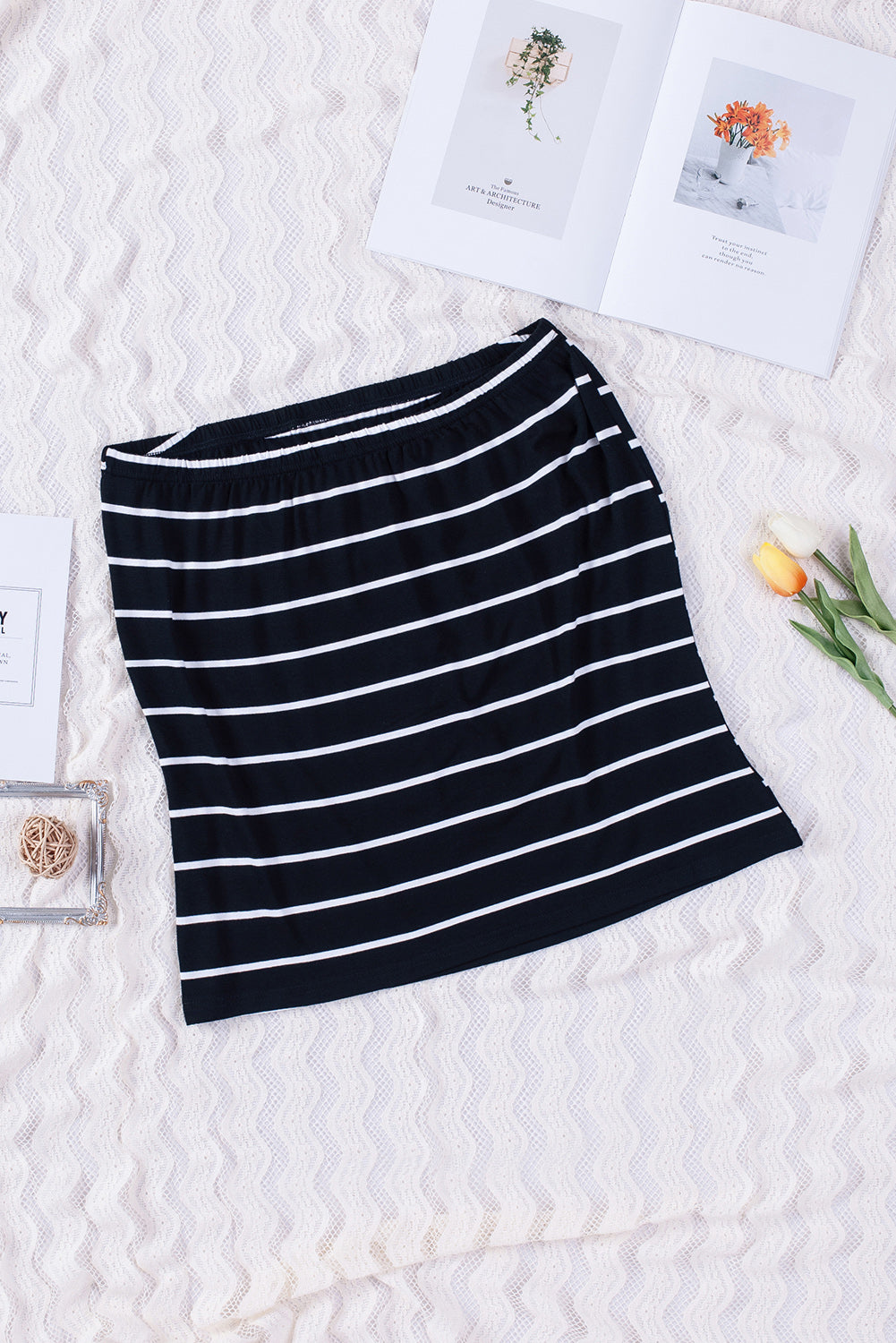 Black Striped Strapless Bandeau Tank showcasing a classic striped pattern, perfect for summer styling.