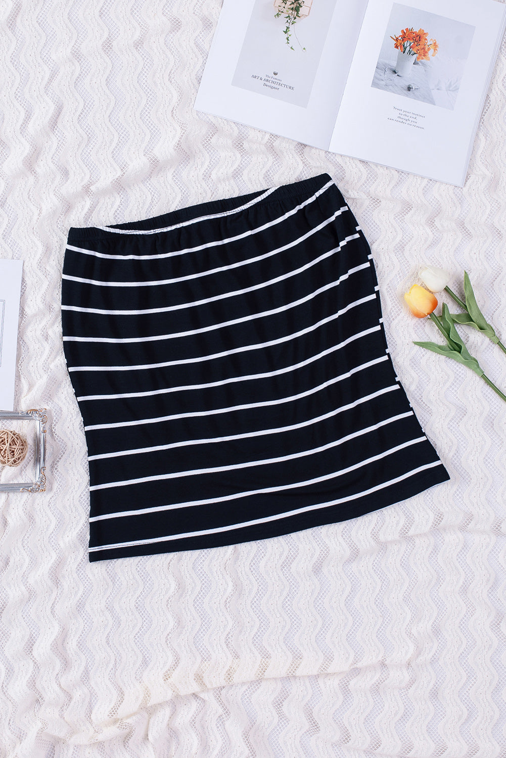 Black Striped Strapless Bandeau Tank showcasing a classic striped pattern, perfect for summer styling.