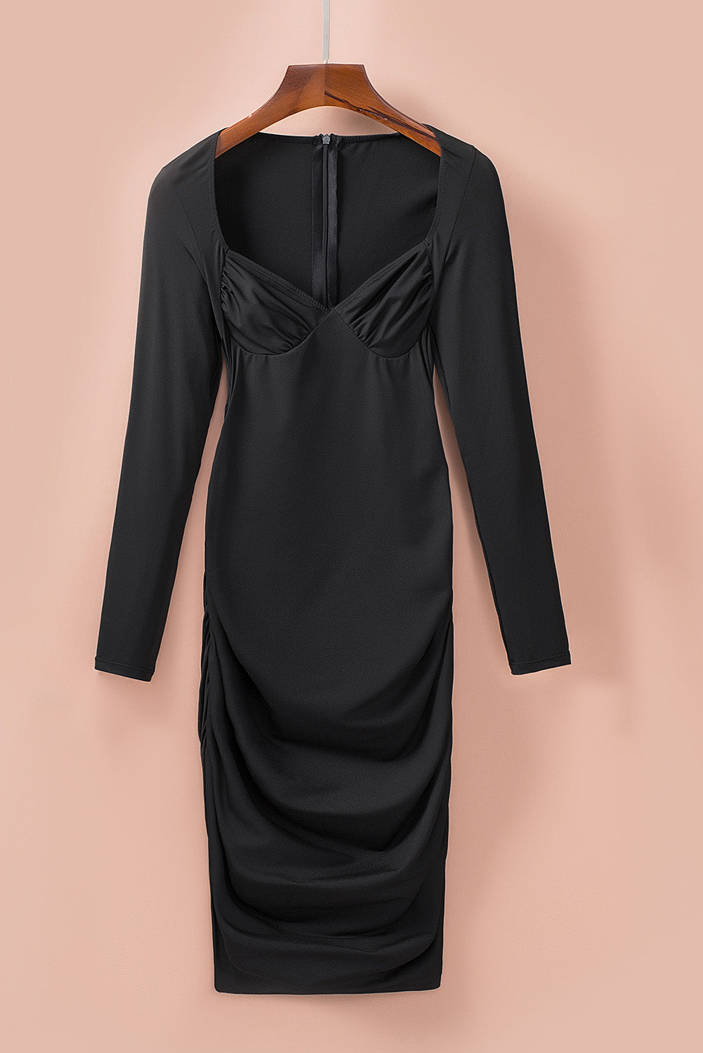 Black Sweetheart Long Sleeve Ruched Bodycon Mini Dress showcasing a flattering silhouette with long sleeves and a sweetheart neckline.