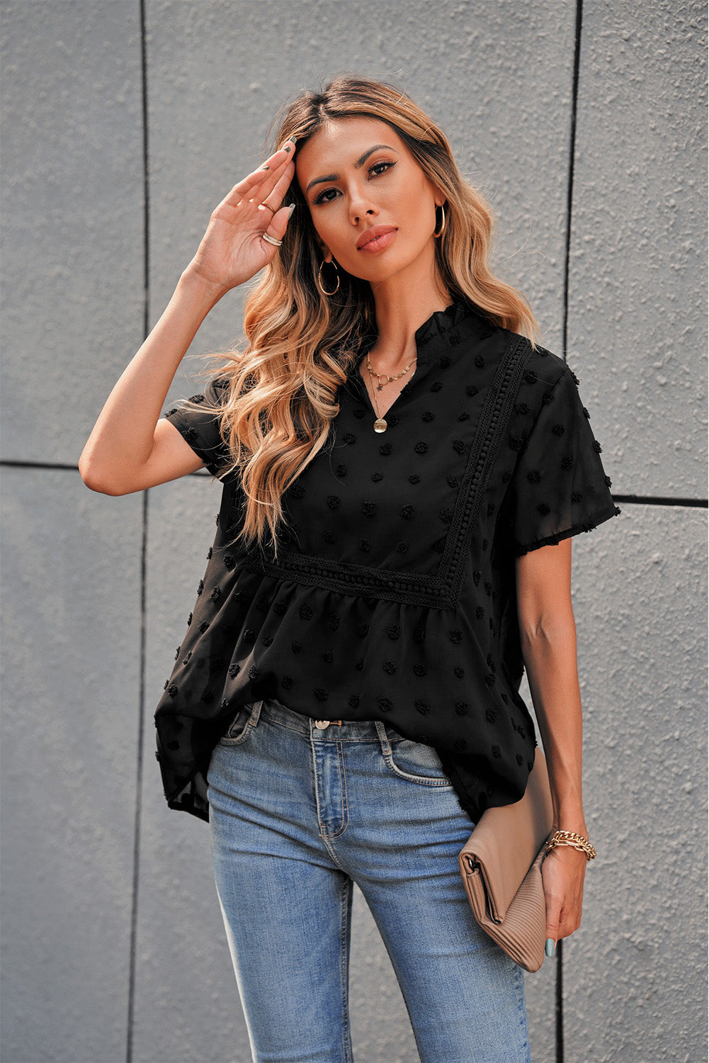 Black Swiss Dot Short Sleeve Flowy Top featuring a chic babydoll style with a soft, sheer fabric and elegant swiss dot texture.