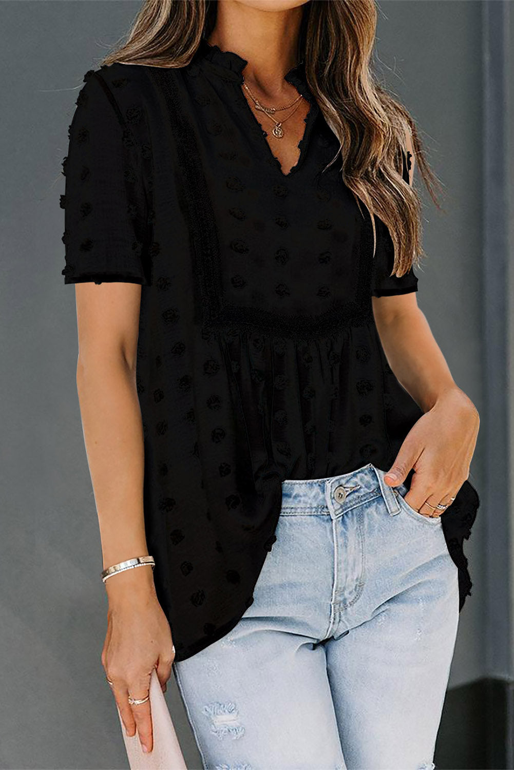 Black Swiss Dot Short Sleeve Flowy Top featuring a chic babydoll style with a soft, sheer fabric and elegant swiss dot texture.