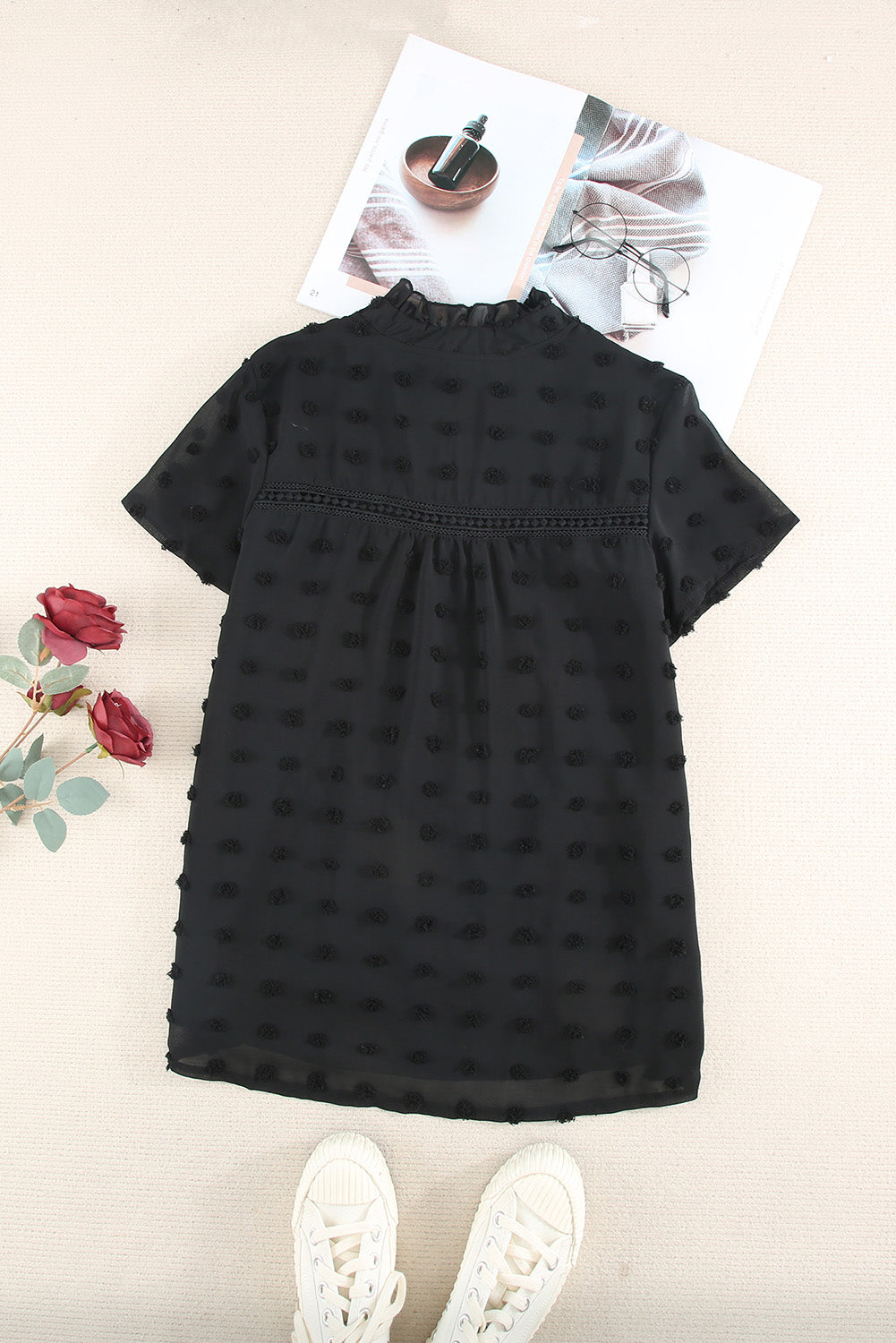 Black Swiss Dot Short Sleeve Flowy Top featuring a chic babydoll style with a soft, sheer fabric and elegant swiss dot texture.