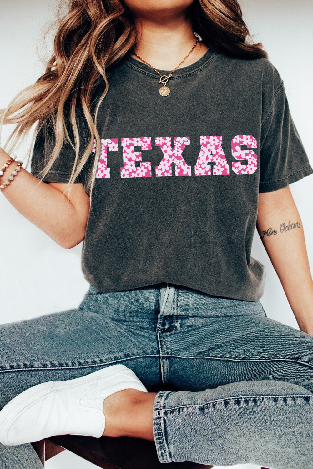 Black TEXAS Graphic Mineral Wash T-shirt featuring a bold TEXAS print, showcasing a stylish and comfortable design suitable for casual wear.