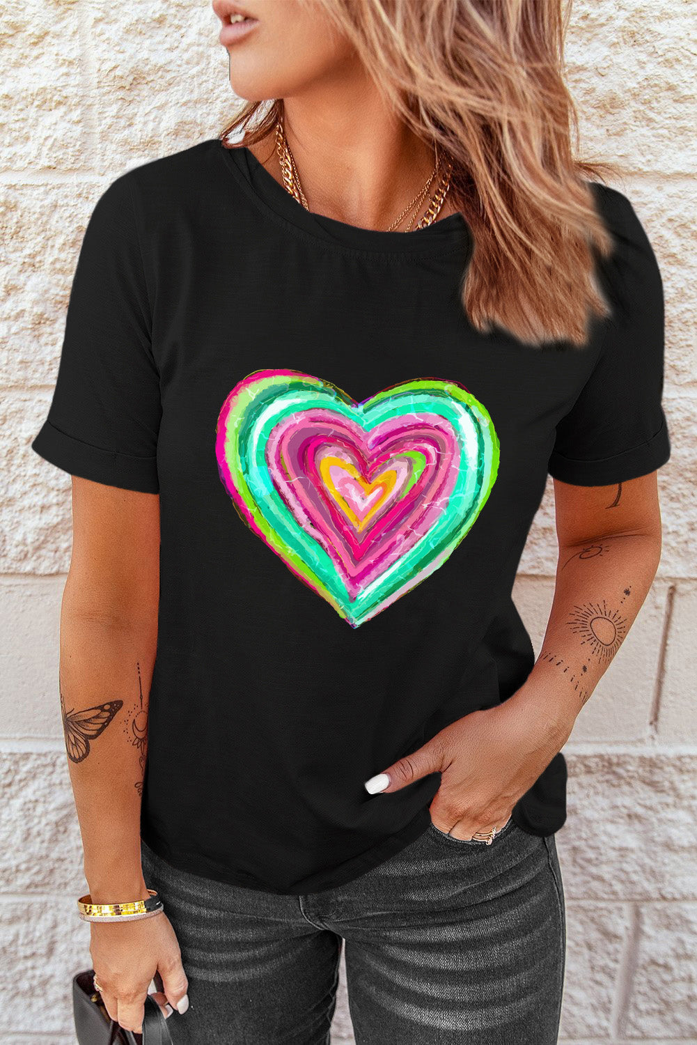 Black crew neck t-shirt featuring a heart-shaped print, perfect for Valentine's Day celebrations.