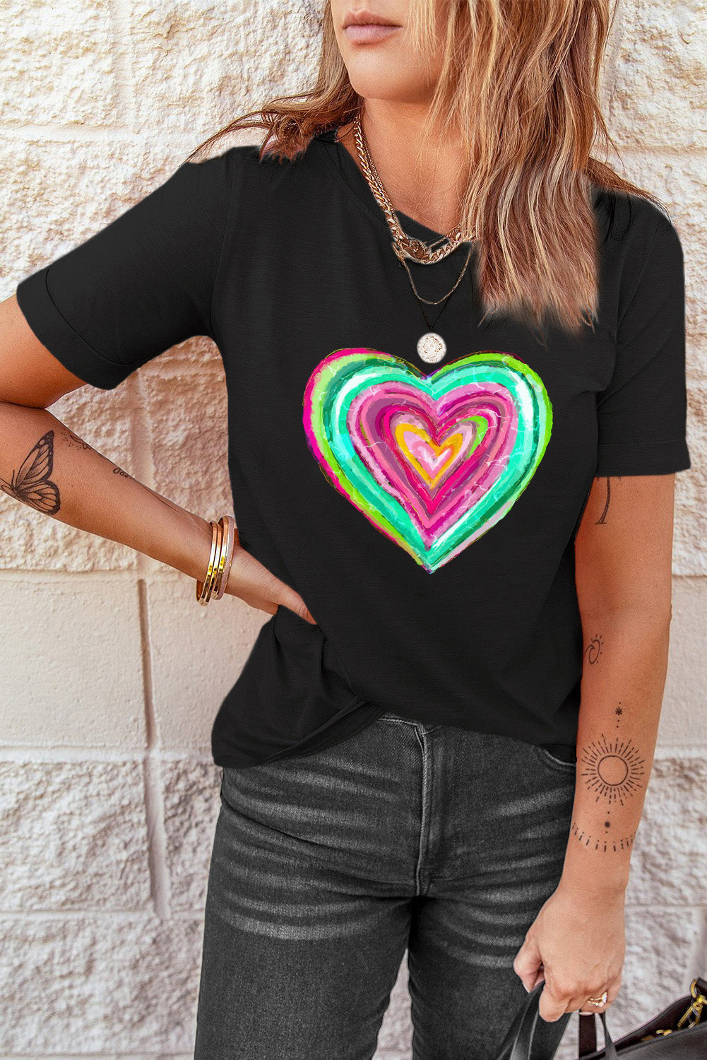 Black crew neck t-shirt featuring a heart-shaped print, perfect for Valentine's Day celebrations.