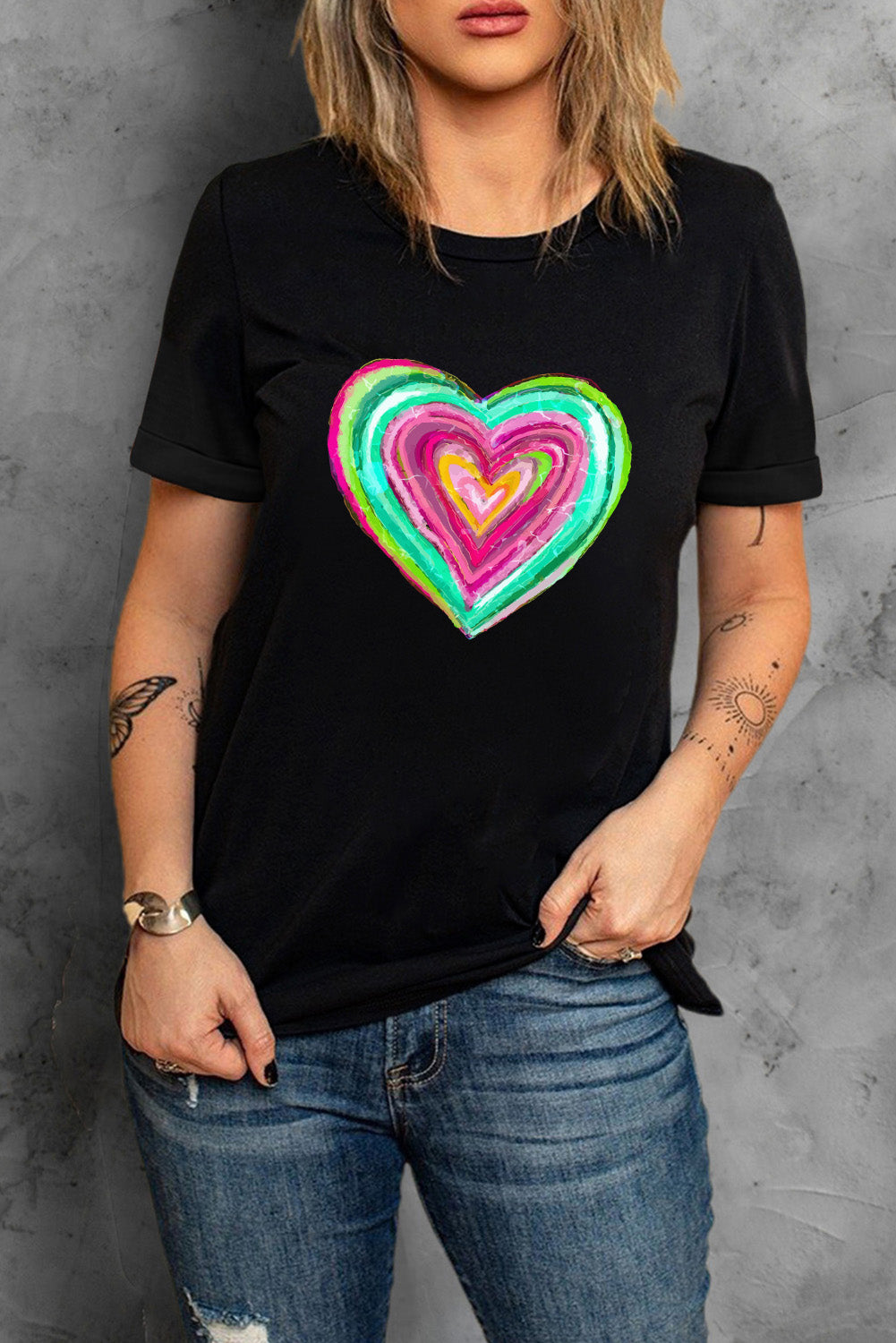 Black crew neck t-shirt featuring a heart-shaped print, perfect for Valentine's Day celebrations.