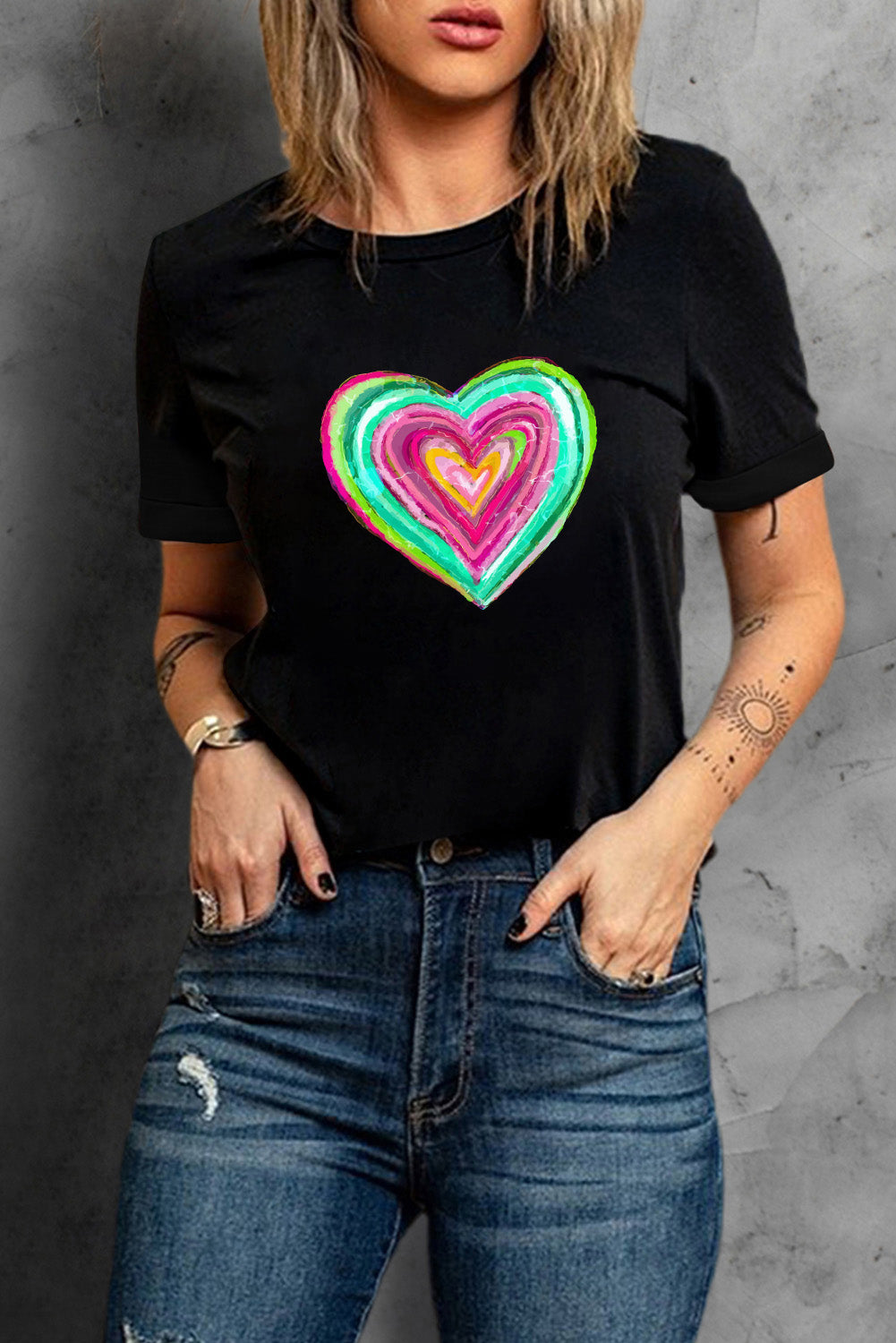 Black crew neck t-shirt featuring a heart-shaped print, perfect for Valentine's Day celebrations.