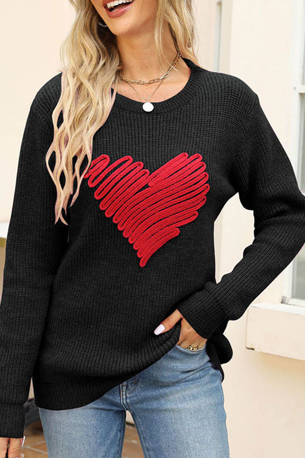 Black round neck sweater featuring a romantic heart sketch design, perfect for winter wear.