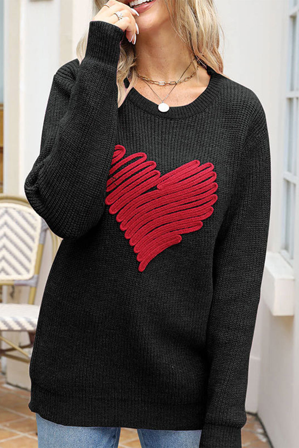 Black round neck sweater featuring a romantic heart sketch design, perfect for winter wear.