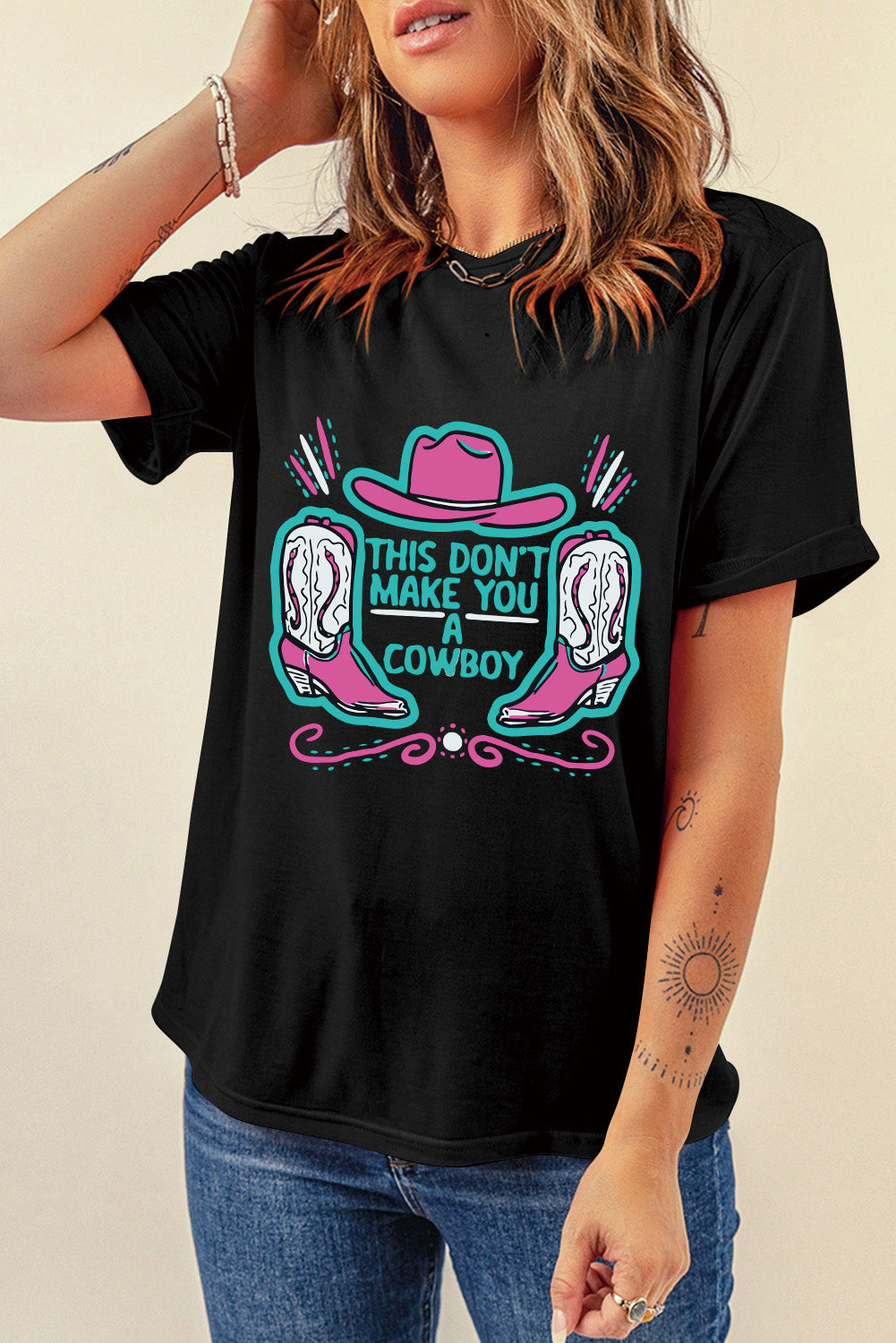 Black crew neck t-shirt featuring a western hat and boots slogan print, showcasing a stylish design for casual wear.