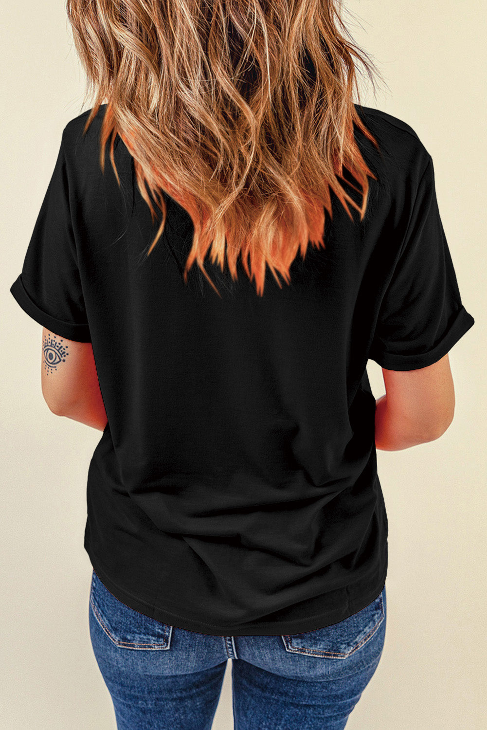 Black crew neck t-shirt featuring a western hat and boots slogan print, showcasing a stylish design for casual wear.