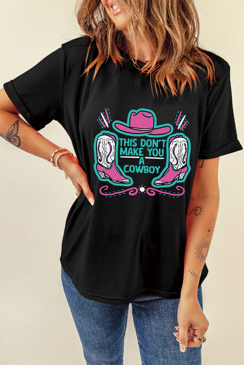 Black crew neck t-shirt featuring a western hat and boots slogan print, showcasing a stylish design for casual wear.