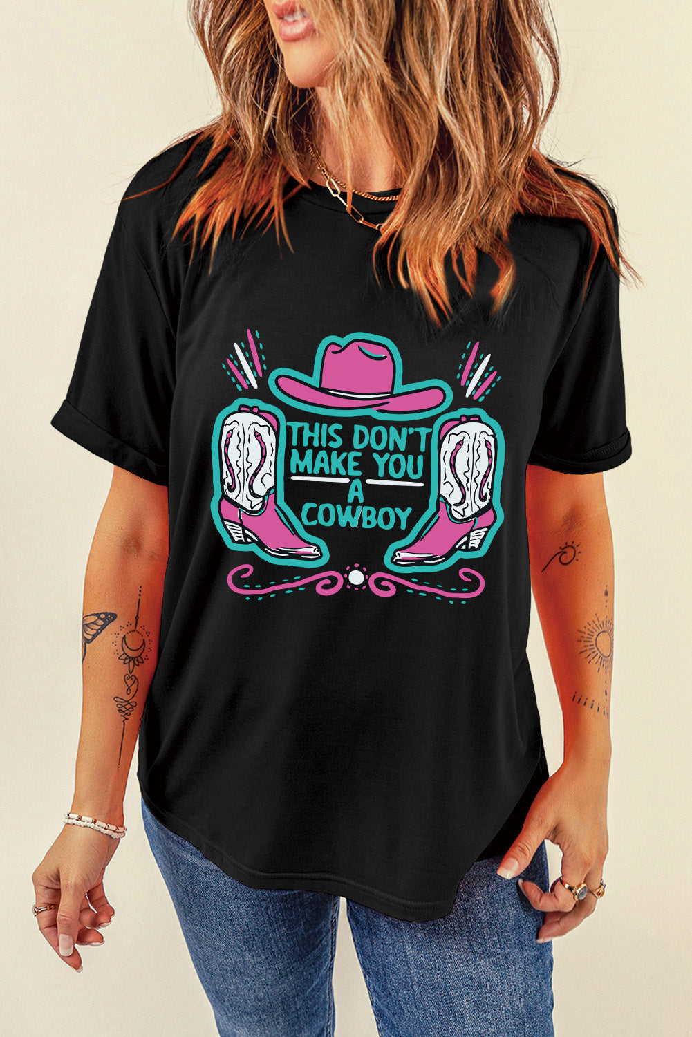 Black crew neck t-shirt featuring a western hat and boots slogan print, showcasing a stylish design for casual wear.