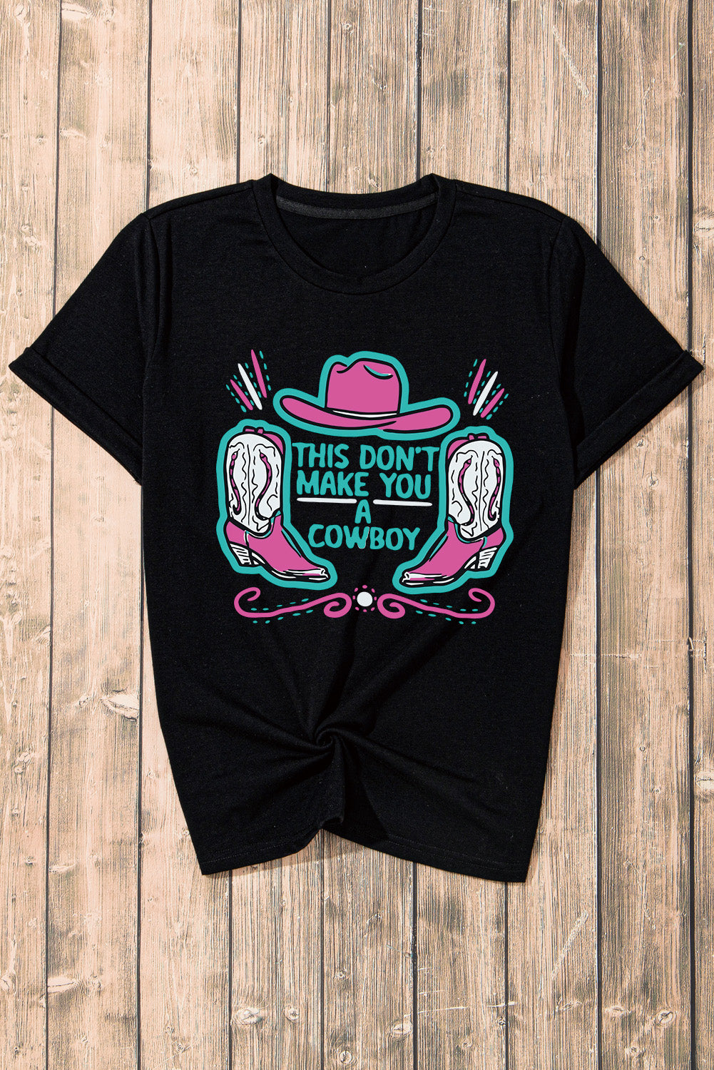 Black crew neck t-shirt featuring a western hat and boots slogan print, showcasing a stylish design for casual wear.