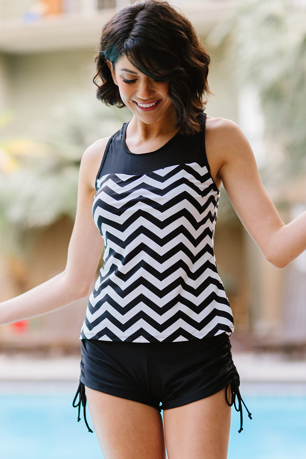 Black and white zigzag print tankini swimsuit featuring a mesh splice design and matching boyshort swim bottom.