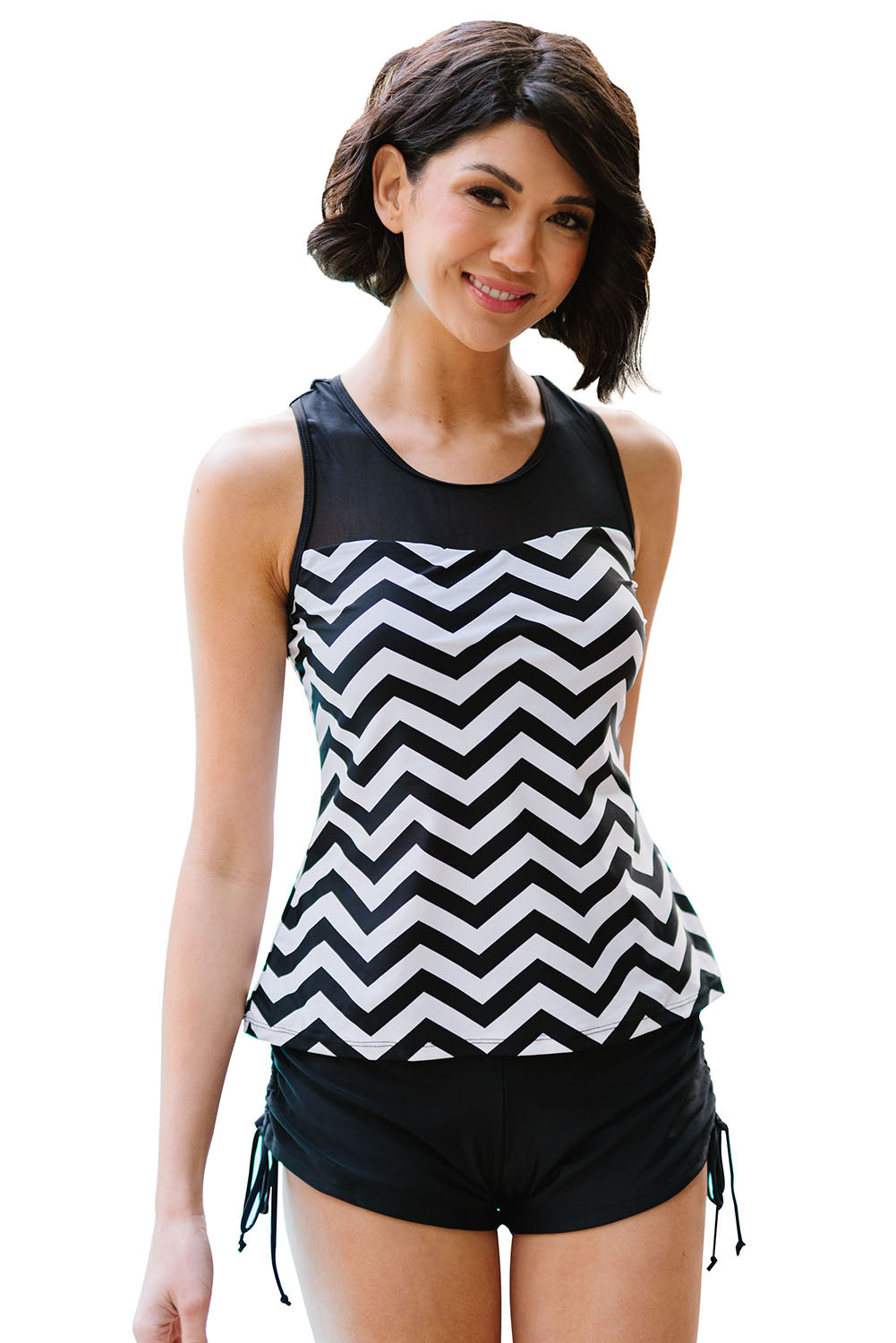 Black and white zigzag print tankini swimsuit featuring a mesh splice design and matching boyshort swim bottom.