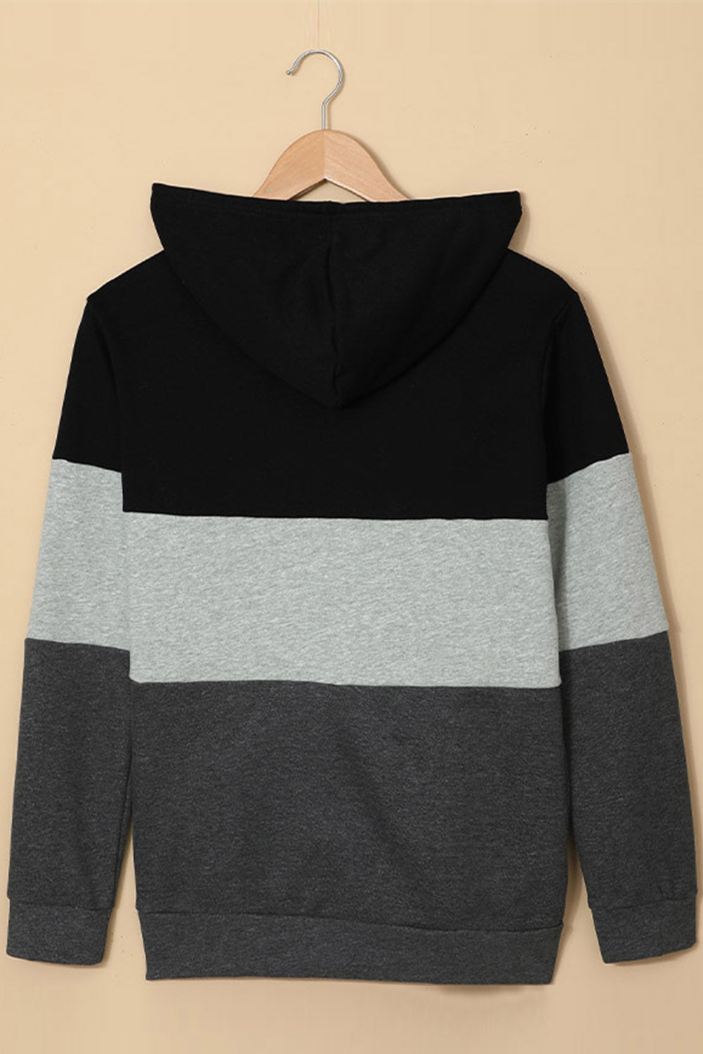 Black zip front hoodie featuring color block splicing and drawstring hood, perfect for casual wear.