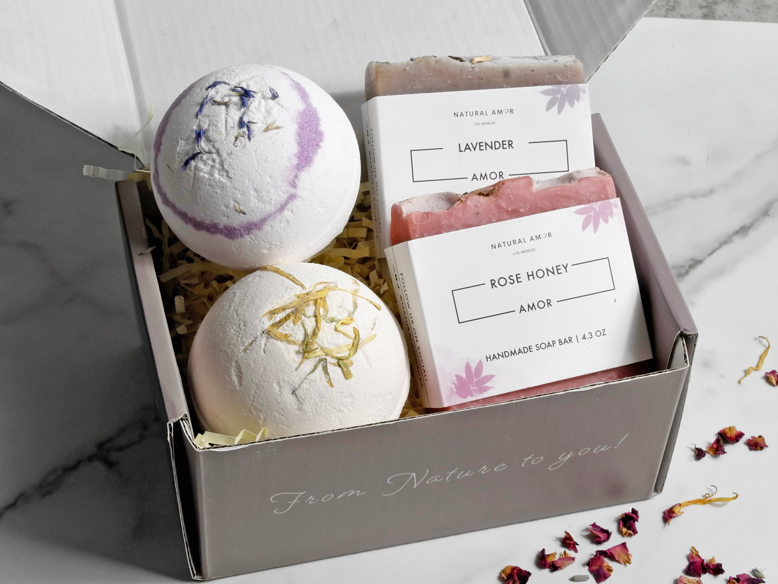 Blooming Gift Box featuring bath bombs, handmade soap, and rose hand cream in an elegant packaging.