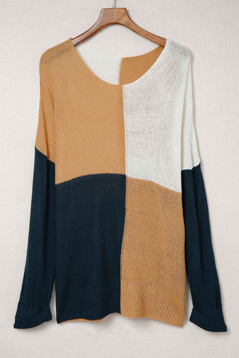 A stylish blue color block plus size sweater featuring side slits, designed for comfort and a chic look.