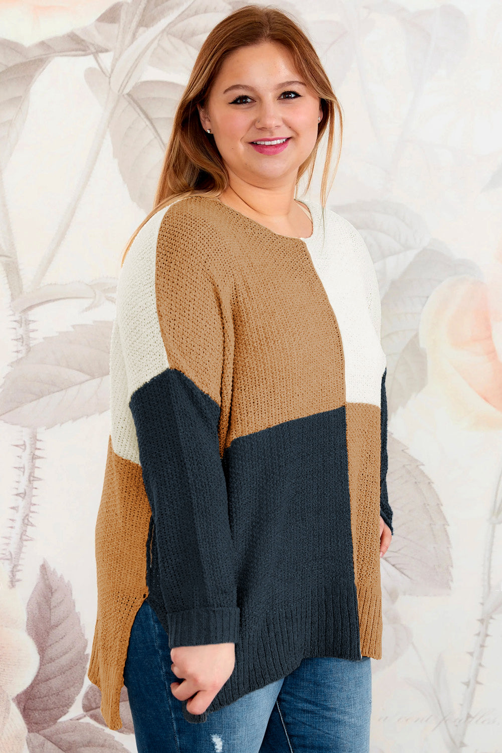 A stylish blue color block plus size sweater featuring side slits, designed for comfort and a chic look.