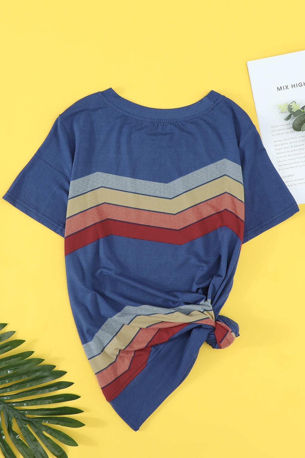 Blue short sleeve tee featuring colorful wavy stripes print, perfect for casual wear.