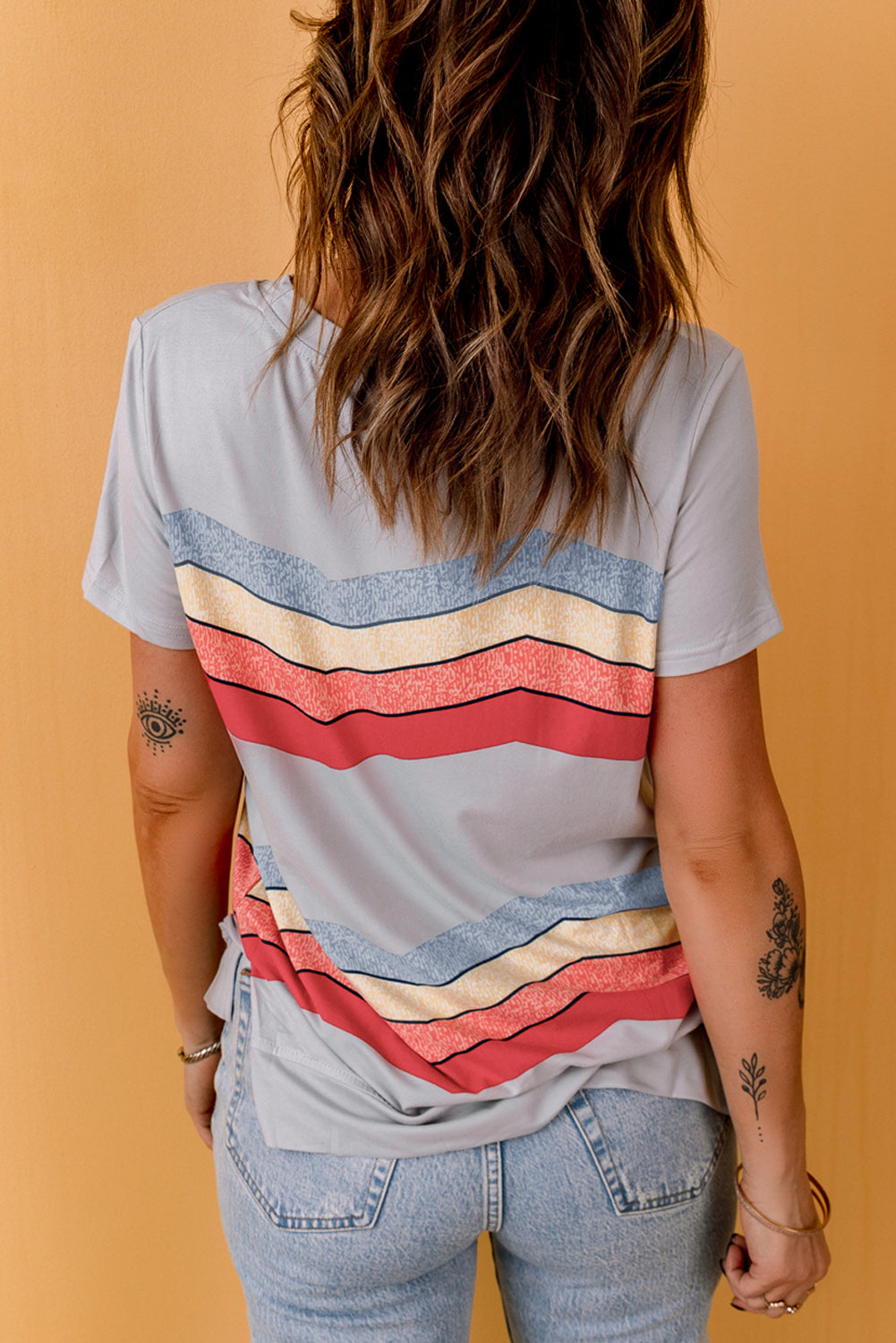 Blue short sleeve tee featuring colorful wavy stripes print, perfect for casual wear.