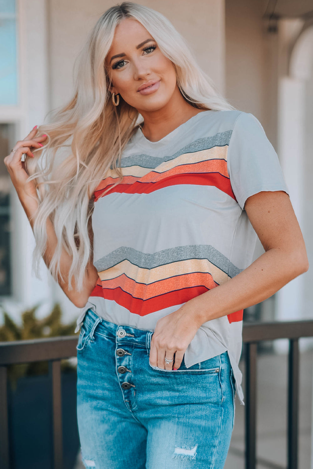 Blue short sleeve tee featuring colorful wavy stripes print, perfect for casual wear.