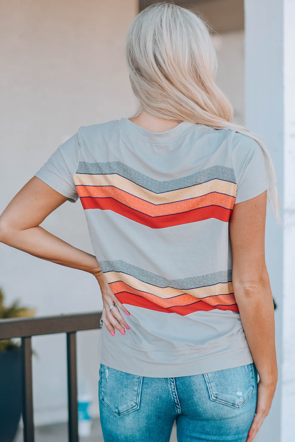 Blue short sleeve tee featuring colorful wavy stripes print, perfect for casual wear.