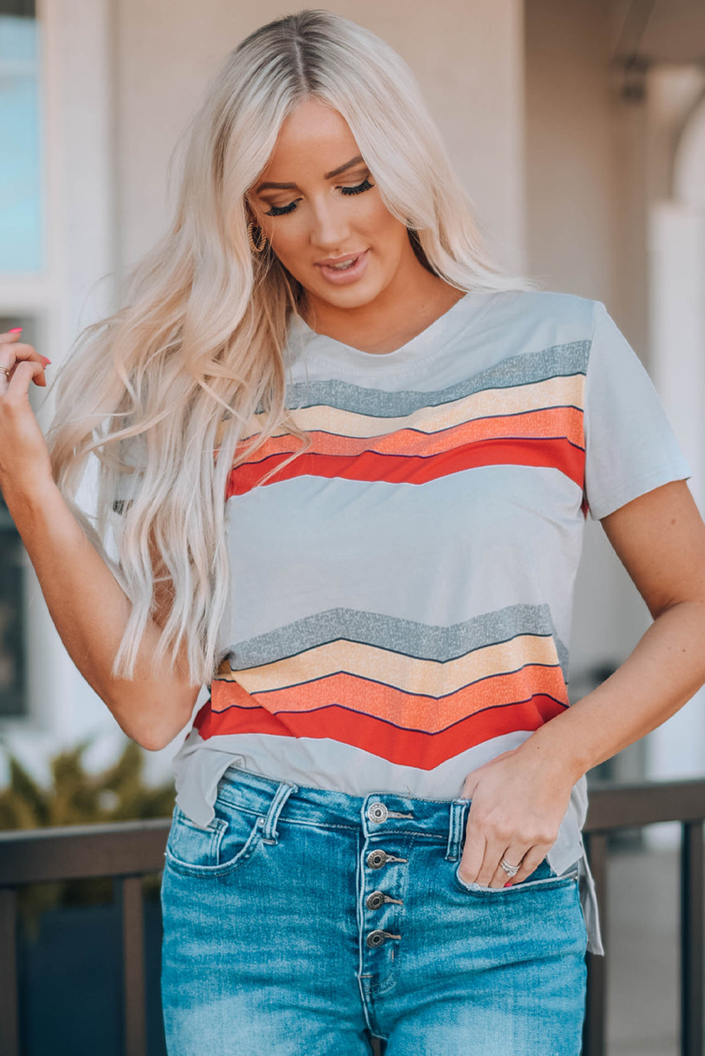 Blue short sleeve tee featuring colorful wavy stripes print, perfect for casual wear.