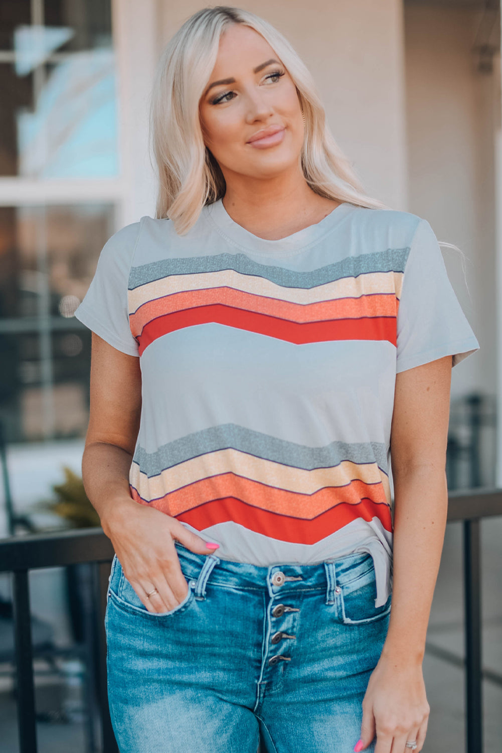 Blue short sleeve tee featuring colorful wavy stripes print, perfect for casual wear.