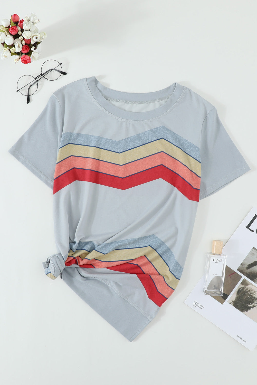 Blue short sleeve tee featuring colorful wavy stripes print, perfect for casual wear.